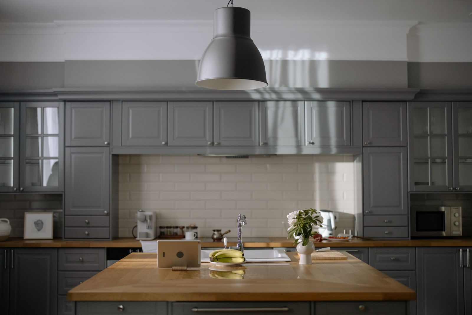 A smoothie being prepared in a calm apartment kitchen at dawn