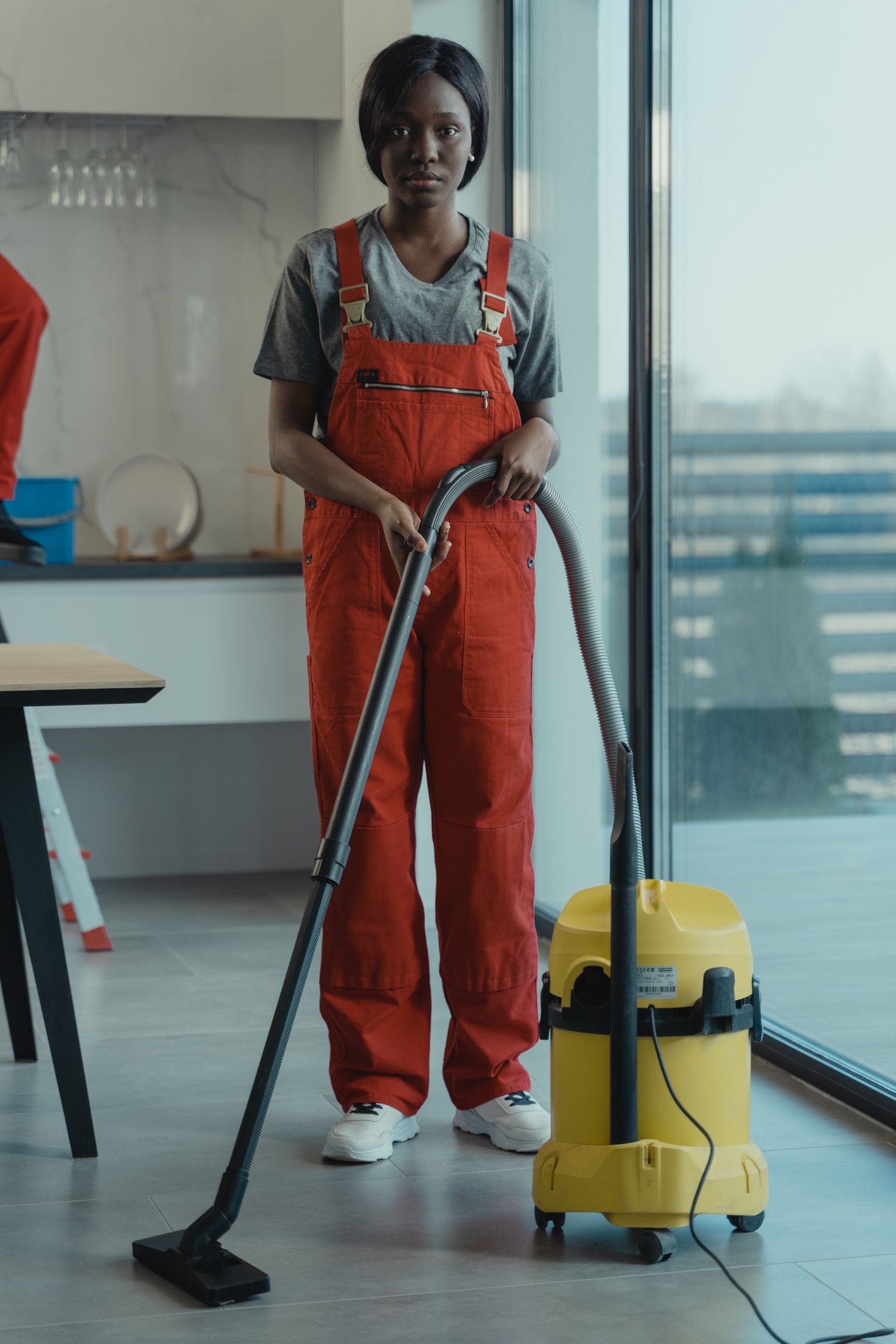 A microfiber mop cleaning a bright lived-in entryway floor