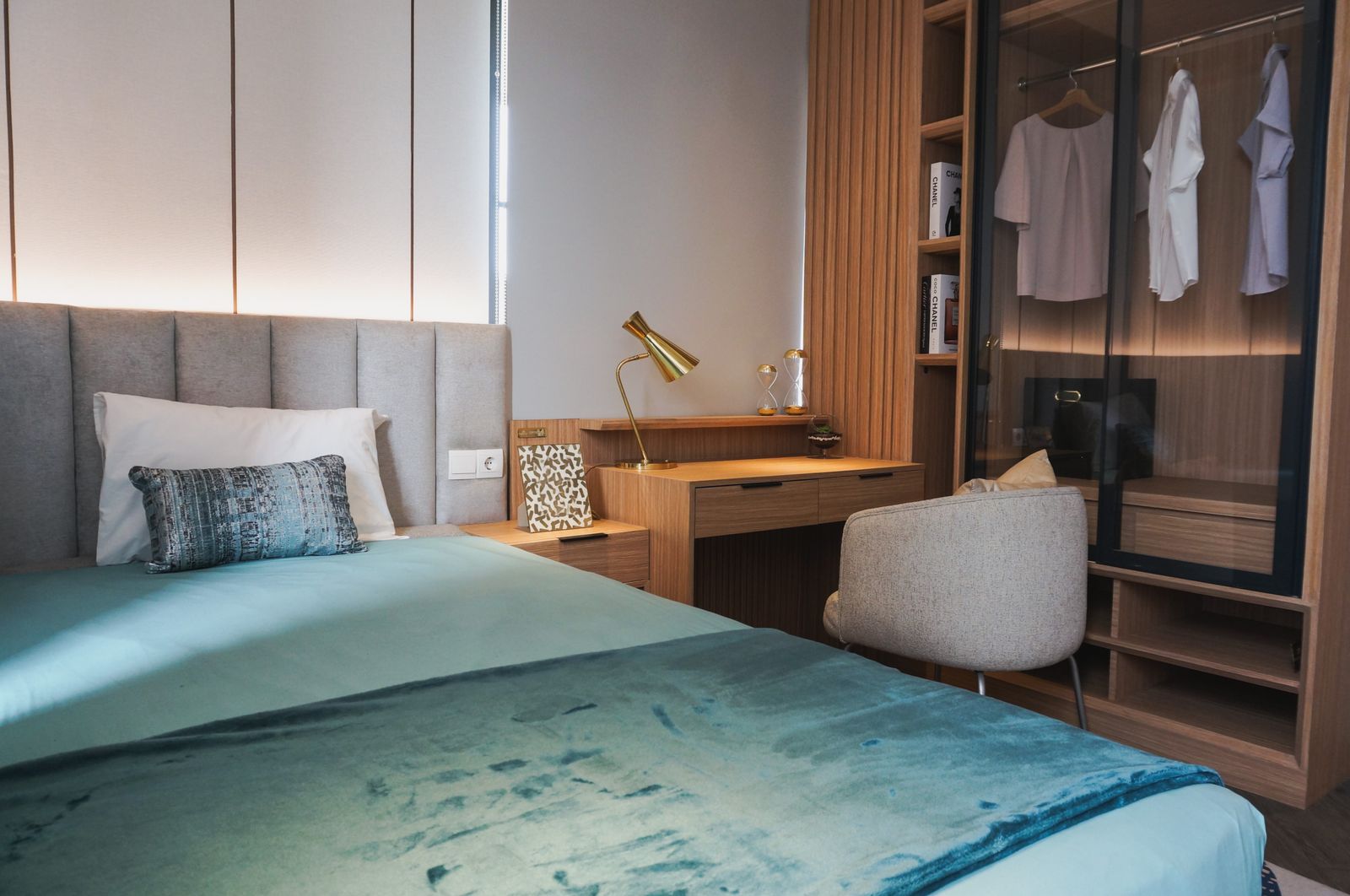 Natural bed sheets in a calm lived-in bedroom with morning light