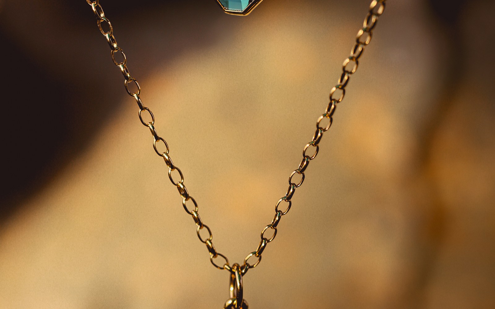 A woman wearing a simple pendant necklace with an everyday neckline