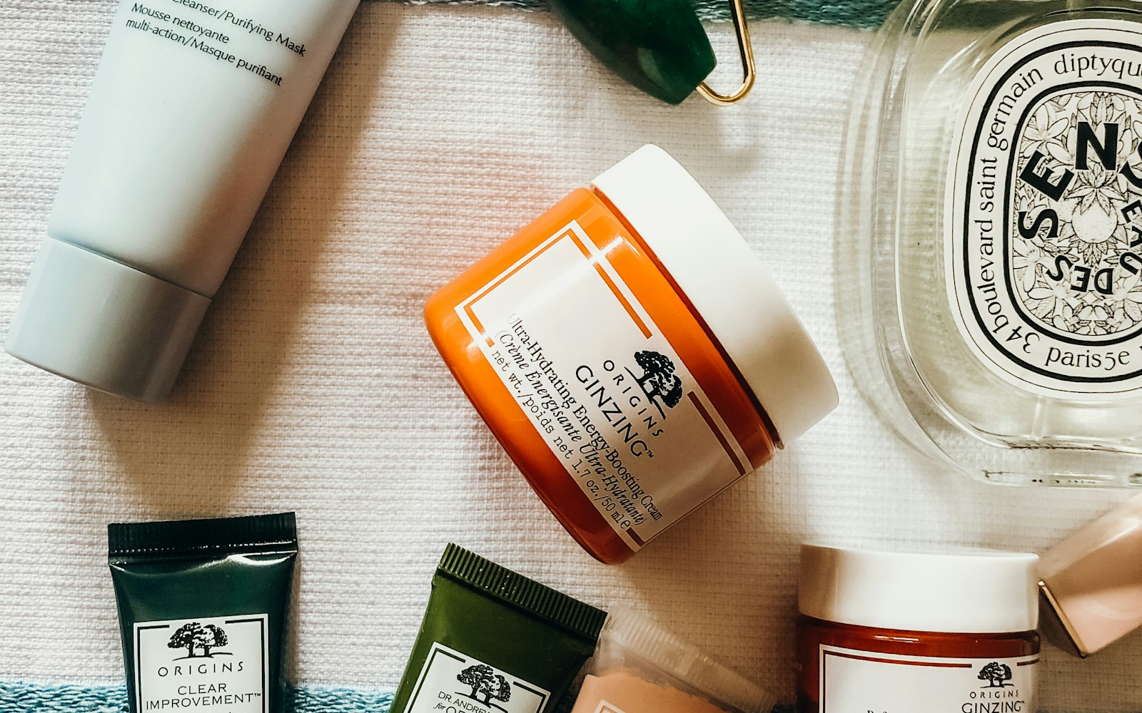 A skincare serum in dark packaging used in a real morning bathroom routine
