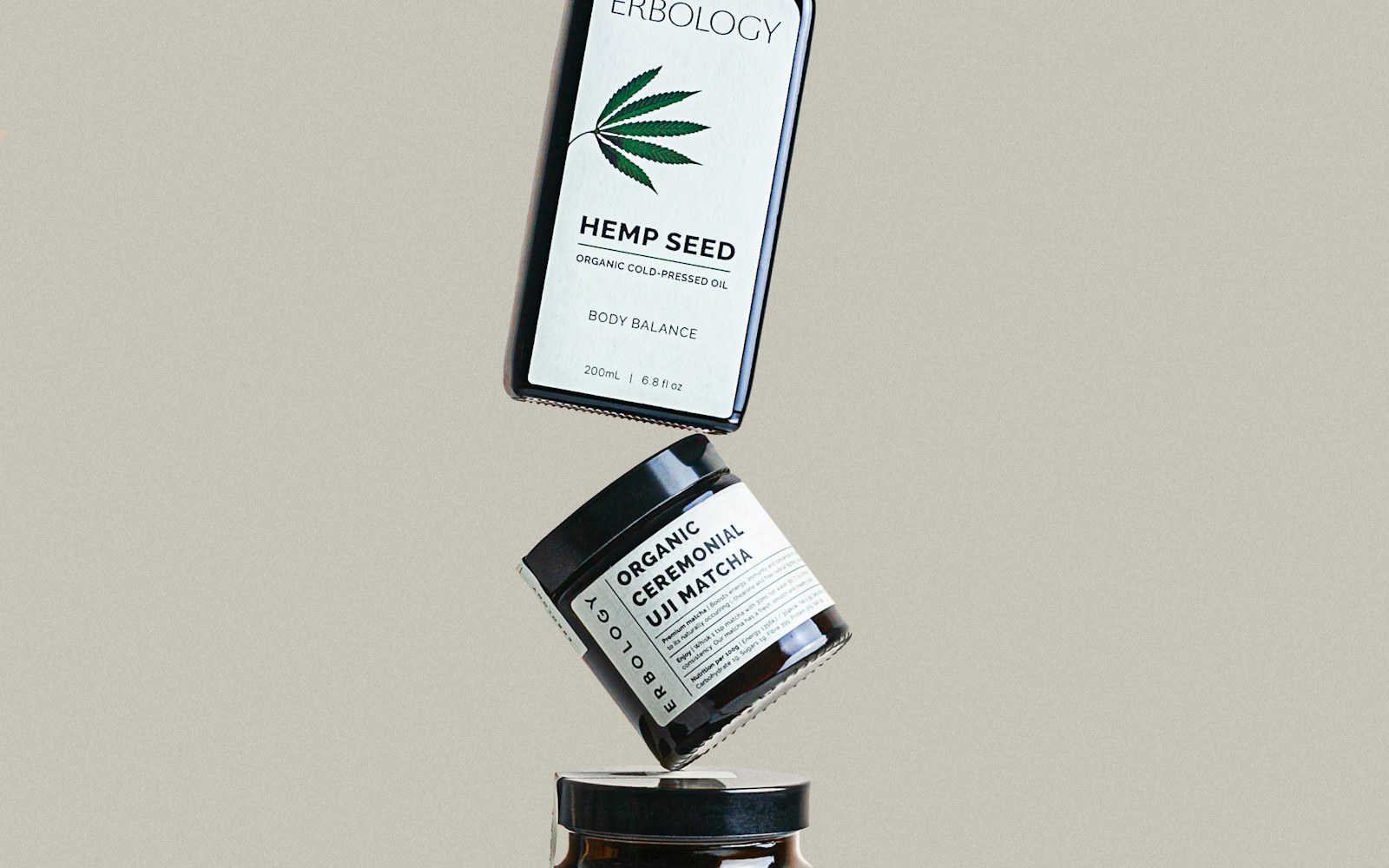 A realistic toiletry bag being packed with skincare bottles for travel